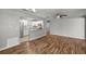 Bright living room and kitchen with stainless appliances and wood floors throughout the home at 15044 Sw 35Th Avenue Rd, Ocala, FL 34473
