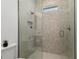 Modern bathroom featuring a glass enclosed shower and neutral tile at 1784 Nw 85Th Loop, Ocala, FL 34475