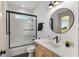 Stylish bathroom with a shower-tub combo, modern vanity, and decorative fixtures at 1784 Nw 85Th Loop, Ocala, FL 34475