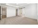 Spacious bedroom with carpeted floors, recessed lighting and a sliding barn door at 1784 Nw 85Th Loop, Ocala, FL 34475