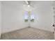 Bright bedroom with a large windows, neutral walls, and carpeting at 1784 Nw 85Th Loop, Ocala, FL 34475