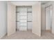 Open closet with adjustable shelving and hanging rods, perfect for maximizing storage and organization at 1784 Nw 85Th Loop, Ocala, FL 34475