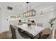 Bright dining area features a marble table, stylish chairs, and an open-concept design at 1784 Nw 85Th Loop, Ocala, FL 34475