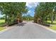 Elegant gated entrance to Irish Acres with brick pillars and lush landscaping creating a sense of arrival at 1784 Nw 85Th Loop, Ocala, FL 34475