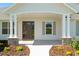 Inviting front porch with stone accents and well-maintained landscaping offering curb appeal and a warm welcome at 1784 Nw 85Th Loop, Ocala, FL 34475