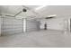 Spacious three car garage featuring automatic doors and ample space for parking and storage at 1784 Nw 85Th Loop, Ocala, FL 34475