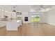 Open-concept kitchen featuring white cabinets, a large island, and modern appliances, perfect for entertaining at 1784 Nw 85Th Loop, Ocala, FL 34475