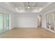 Spacious living room with light wood floors, recessed lighting and sliders to the backyard at 1784 Nw 85Th Loop, Ocala, FL 34475