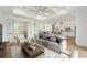 Spacious living room featuring a trey ceiling, modern lighting, and open floor plan at 1784 Nw 85Th Loop, Ocala, FL 34475