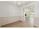 Open-concept living space showcasing modern wainscoting, wood floors, and recessed lighting at 1784 Nw 85Th Loop, Ocala, FL 34475