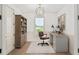 Home office with a large window, built-in bookcase, and a neutral color scheme at 1784 Nw 85Th Loop, Ocala, FL 34475