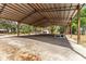 Large, covered carport provides ample parking and storage space at 18027 Se 90Th St, Ocklawaha, FL 32179