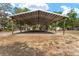 Expansive carport space ideal for vehicle storage or conversion to an outdoor workspace at 18027 Se 90Th St, Ocklawaha, FL 32179