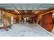 Spacious garage with exposed wood beams and concrete floor at 18027 Se 90Th St, Ocklawaha, FL 32179