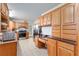 Spacious kitchen featuring tile floors, stainless steel appliances, and lots of natural light at 18027 Se 90Th St, Ocklawaha, FL 32179