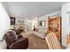 Spacious living room with cozy seating and fireplace at 18027 Se 90Th St, Ocklawaha, FL 32179