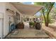 A covered patio showcases an outdoor living space with potted plants and garden decor at 18027 Se 90Th St, Ocklawaha, FL 32179