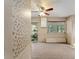 Sunroom with neutral carpet, ceiling fan, and windows at 18027 Se 90Th St, Ocklawaha, FL 32179
