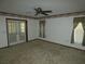Bedroom with ceiling fan, carpet, and French doors leading to the backyard at 20364 Sw 86Th Loop, Dunnellon, FL 34431