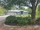 Lovely single story house with stone accent entrance, well landscaped, tree in front yard at 20364 Sw 86Th Loop, Dunnellon, FL 34431