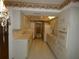 Kitchen with white cabinets, tile flooring, and dining area at 20364 Sw 86Th Loop, Dunnellon, FL 34431