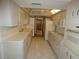 Functional kitchen with white appliances, tile flooring, and ample cabinet space at 20364 Sw 86Th Loop, Dunnellon, FL 34431
