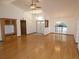 Spacious living room with hardwood floors, chandelier, and views of the front entry at 20364 Sw 86Th Loop, Dunnellon, FL 34431