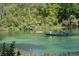 Breathtaking view of the river with people enjoying canoeing and paddle boarding at 20364 Sw 86Th Loop, Dunnellon, FL 34431