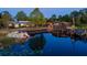 Beautiful waterfront home featuring two houses with a large dock and an inviting pontoon boat at 23800 Ne 190Th St, Fort Mc Coy, FL 32134