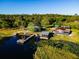 Lakefront property boasts multiple houses, a private dock, and serene waterfront living at 23800 Ne 190Th St, Fort Mc Coy, FL 32134