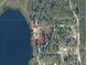 Aerial view highlights the property lines of a home near a lake at 23800 Ne 190Th St, Fort Mc Coy, FL 32134