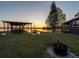 Lakeside property with a covered dock and charming picnic area ready for relaxation and outdoor activities at 23800 Ne 190Th St, Fort Mc Coy, FL 32134