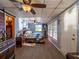A spacious bedroom with natural light from multiple windows and access to another room via a barn door at 23800 Ne 190Th St, Fort Mc Coy, FL 32134