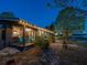Cozy waterfront home with a spacious porch, inviting chairs, and serene lake access at 23800 Ne 190Th St, Fort Mc Coy, FL 32134