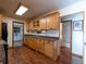 Classic kitchen design with wood cabinetry, granite countertops and adjacent bathroom and bedroom at 23800 Ne 190Th St, Fort Mc Coy, FL 32134