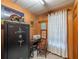 Office space with wood paneled walls, a large safe, and a desk at 23800 Ne 190Th St, Fort Mc Coy, FL 32134