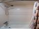 Tiled shower-tub combination featuring a detachable shower head and a decorative shower curtain at 23800 Ne 190Th St, Fort Mc Coy, FL 32134
