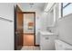 Bathroom featuring modern sink, toilet, and mirror, leading to a bedroom at 28 Gordon Ct, Leesburg, FL 34788