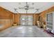 Organized garage space for parking and storage, with room for tools at 28 Gordon Ct, Leesburg, FL 34788