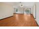 Spacious living room featuring beautiful wood floors, ample natural light, and an open layout for comfortable living at 28 Gordon Ct, Leesburg, FL 34788