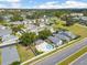 Aerial view of a residential community featuring tree-lined streets and a central pool area at 2935 Sw 41St Pl, Ocala, FL 34474