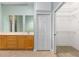 The bathroom includes a double vanity, white cabinets, and a walk-in closet at 2935 Sw 41St Pl, Ocala, FL 34474