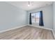 Bedroom featuring wood floors, a ceiling fan, and a large window at 2935 Sw 41St Pl, Ocala, FL 34474