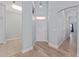 Welcoming entryway featuring modern flooring, a front door with sidelight, and fresh paint at 2935 Sw 41St Pl, Ocala, FL 34474