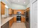 Well-lit kitchen with stainless steel appliances and ample counter space at 2935 Sw 41St Pl, Ocala, FL 34474