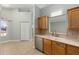 Kitchen featuring stainless appliances, wood cabinets, and tile flooring at 2935 Sw 41St Pl, Ocala, FL 34474
