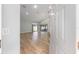 Spacious living room featuring hardwood floors, high ceilings, recessed lighting, and large sliding glass doors at 2935 Sw 41St Pl, Ocala, FL 34474
