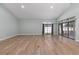 Bright and spacious living room featuring hardwood floors, high ceilings, and sliding glass doors at 2935 Sw 41St Pl, Ocala, FL 34474