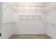 A walk-in closet with white wire shelving and neutral walls at 2935 Sw 41St Pl, Ocala, FL 34474