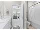 Bathroom featuring a tub and shower combination with white subway tile at 3840 Se 6Th Ave, Ocala, FL 34480